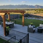 Modern pergola, composite fence, and railing in a Utah backyard