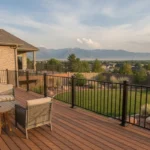 A TimberTech composite deck beside a Utah home with mountain scenery in the background